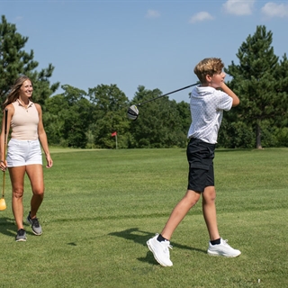 Mother and son golfing at Fairfield Hills.