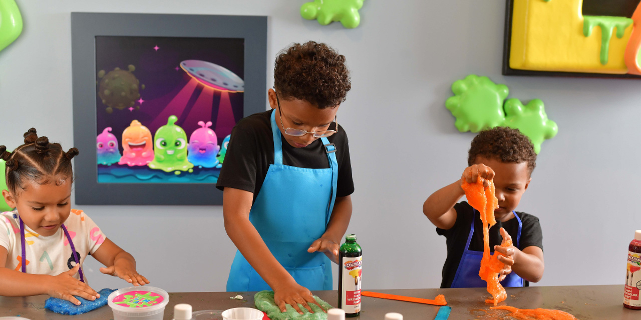 Kids playing with slime at Booby Trap Escape Rooms.
