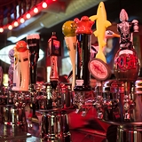 Various beer taps at Showboat Saloon.