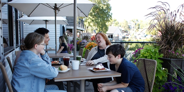 People outside at Bella Goose- Cafe on the River
