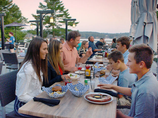 Family dining next to Lake Delton at Summer House Grill & Bar