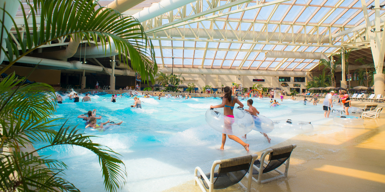 A family relaxes in a cabana at Wilderness Resort Waterparks