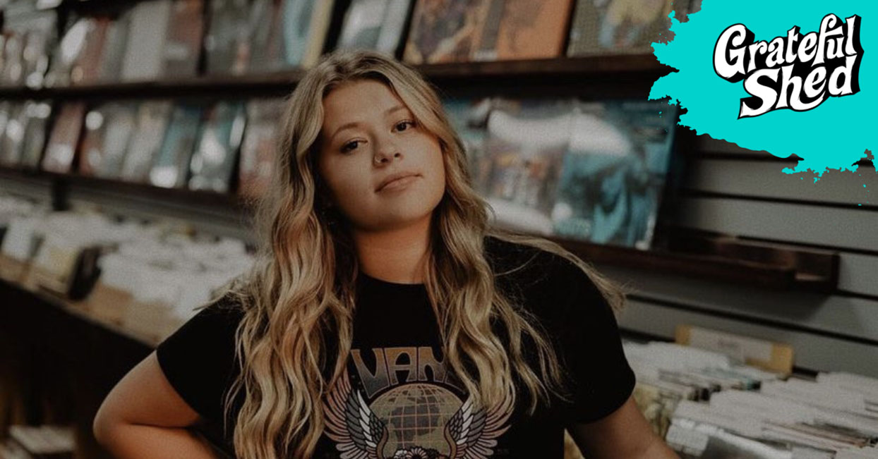 rayna hess standing in front of records at record store