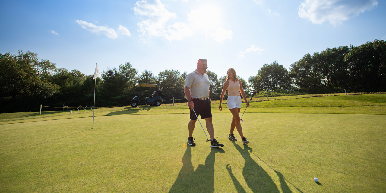 Couple golfing at Fairfield Hills.