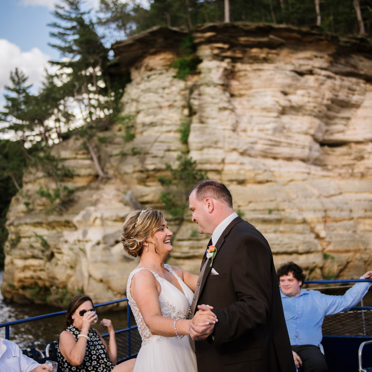 Bride and groom dancing with scenic rock formations on the background.