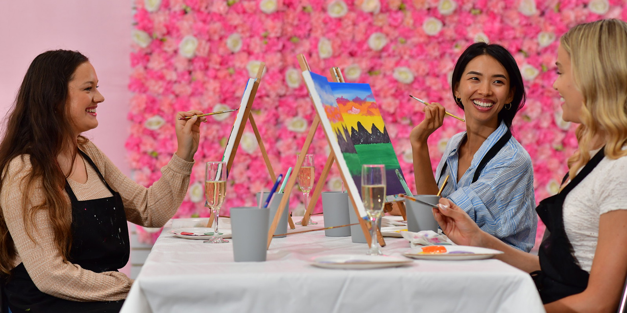 Women painting at Brushes & Bubbly.