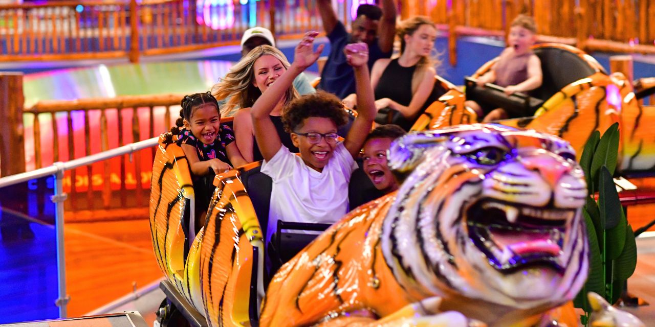 people on tiger themed coaster