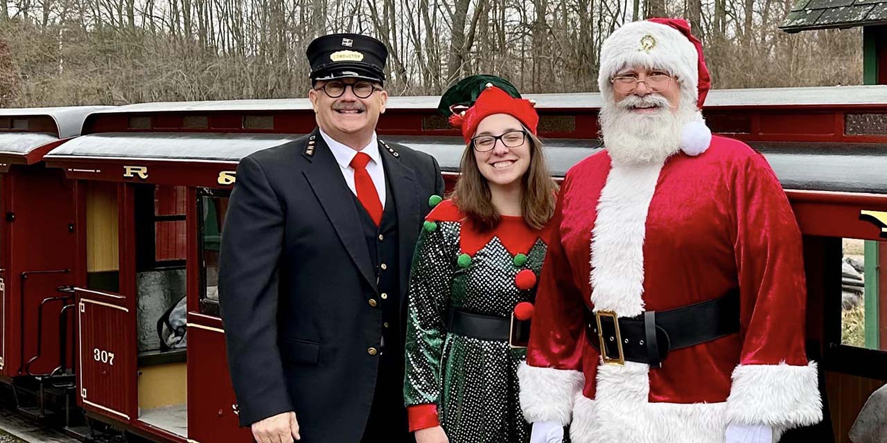 Santa, conductor, and elf at Riverside & Great Northern Railway