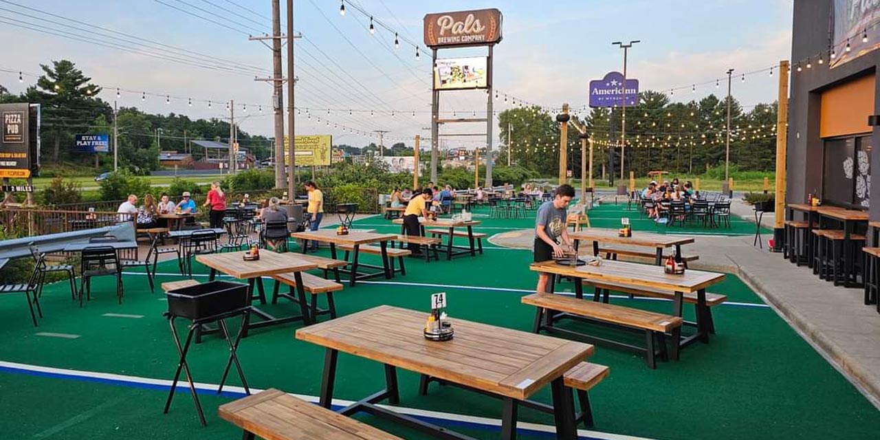 Large outdoor dining patio with turf.