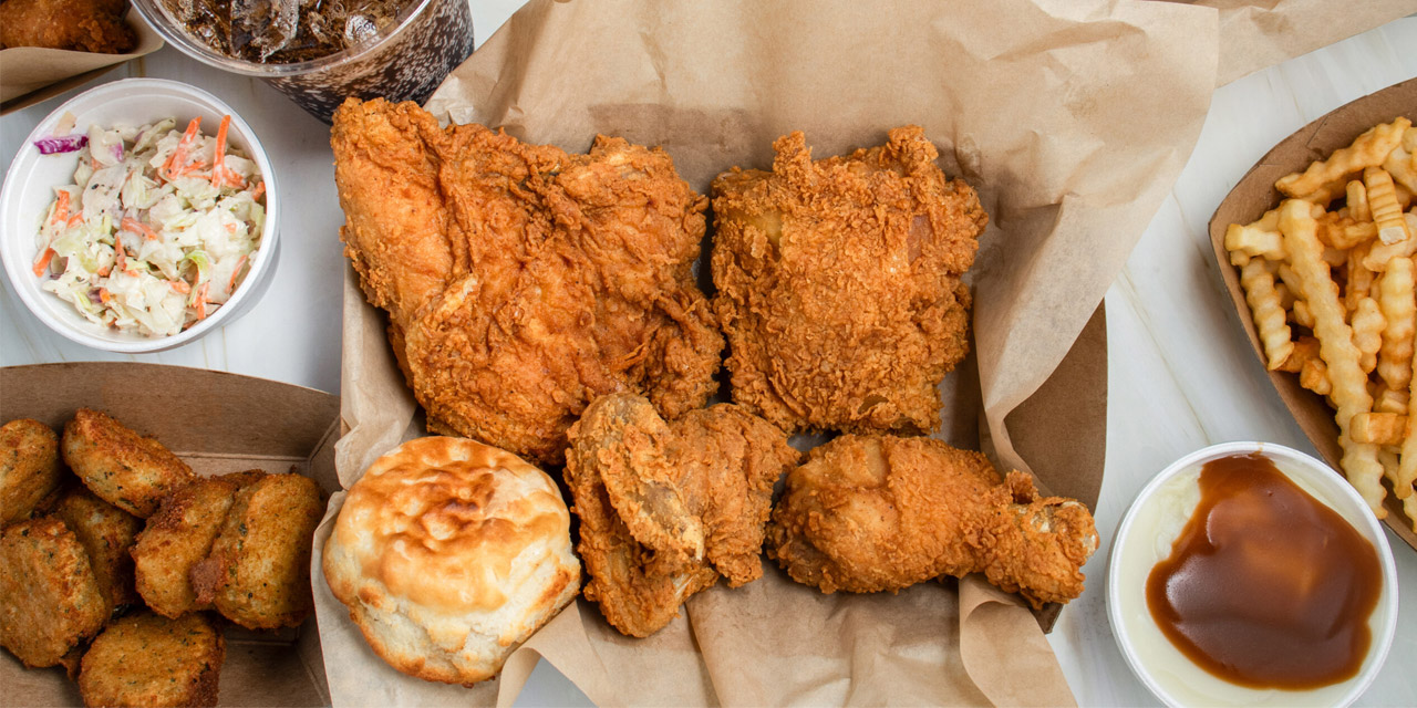 Flat lay image of plated food including chicken.