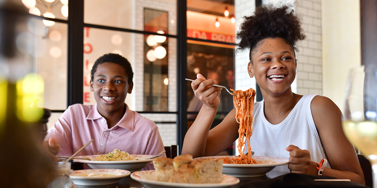 Family eating Italian food.