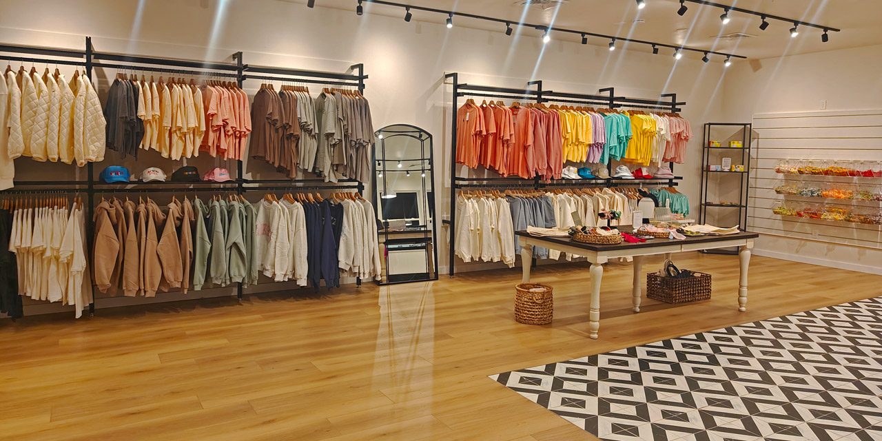 Shop interior with a lot of colorful shirts.